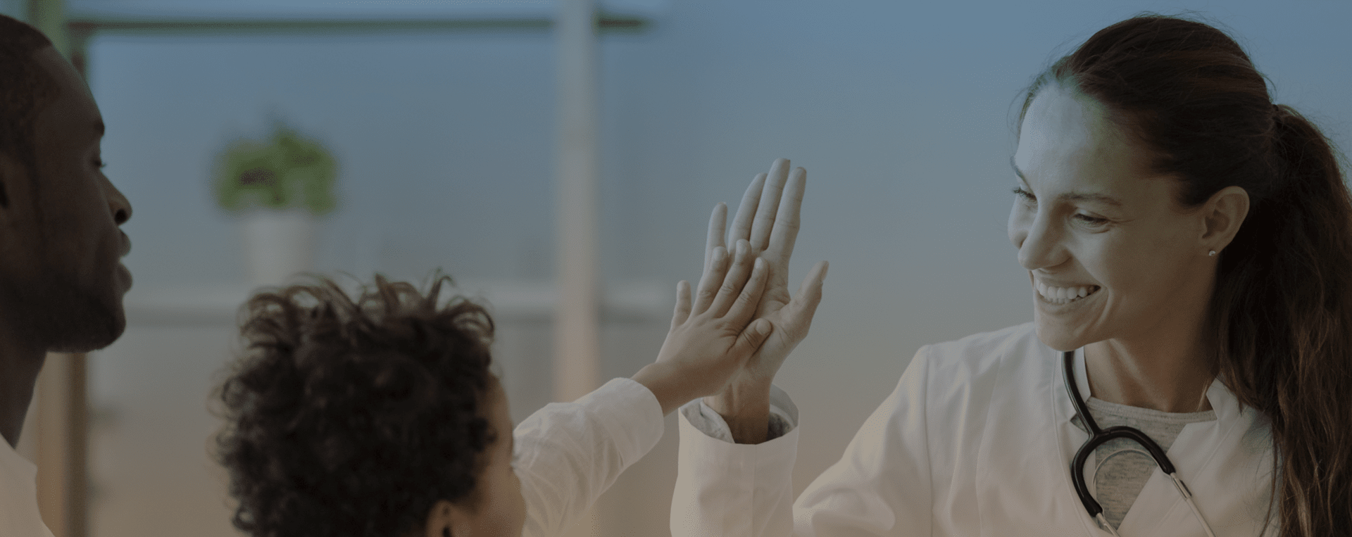 Medical provider high-fiving a patient